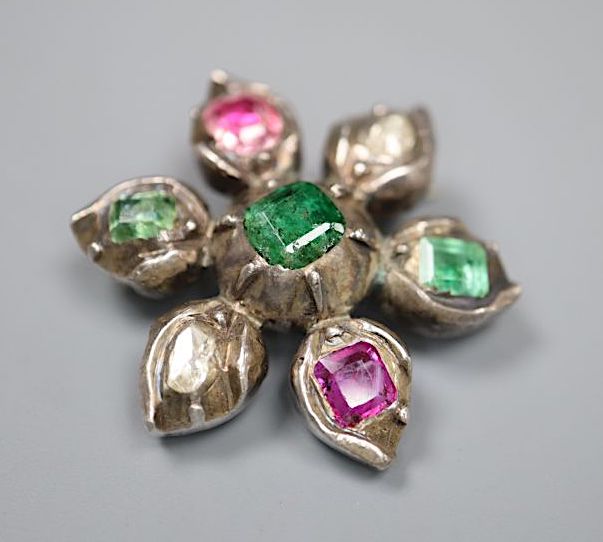 A 19th century white metal emerald, rose cut diamond and foil backed ruby? set flower head brooch, 31mm, gross 14.3 grams,